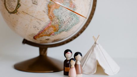 pexels-photo-3932932 retro globe with handmade toys against gray background in room