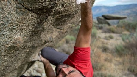 pexels-photo-946337 man climbing on gray concrete peak at daytime