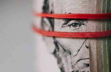 roll of american dollar banknotes tightened with band