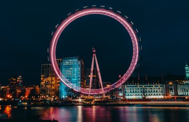 pexels-photo-3835461 luminous ferris wheel in modern city district on river bank at night