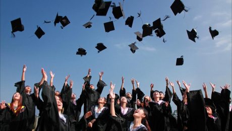 pexels-photo-267885 newly graduated people wearing black academy gowns throwing hats up in the air