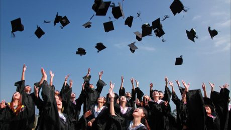 pexels-photo-267885 newly graduated people wearing black academy gowns throwing hats up in the air